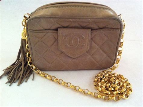 vintage chanel tan calfskin purse with inbosed chanel|luxury Chanel bag.